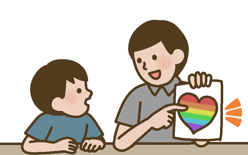 LGBTQIAシンボルマークを説明する父親と子ども